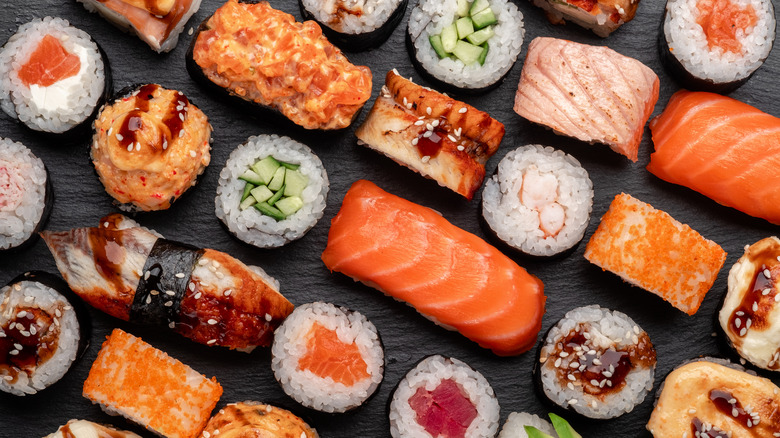 Overhead shot of a variety of types of sushi and sashimi