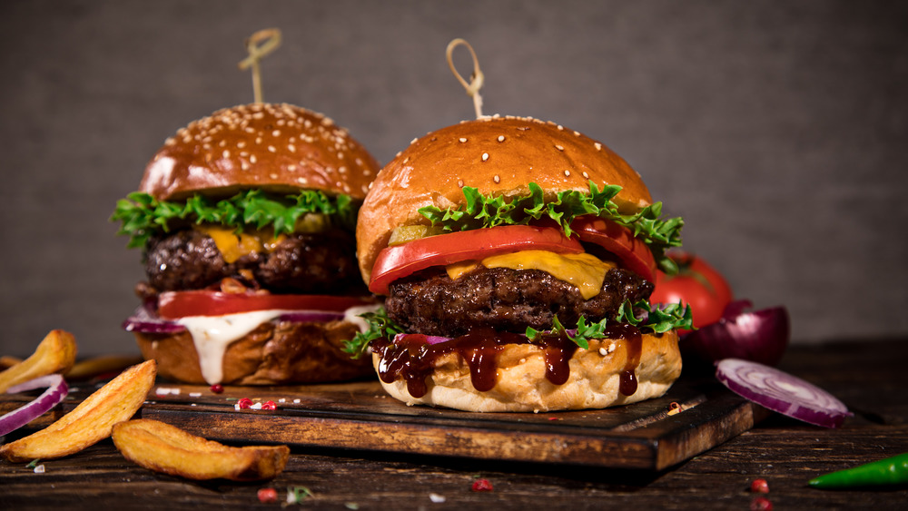 two fast food burgers on a table