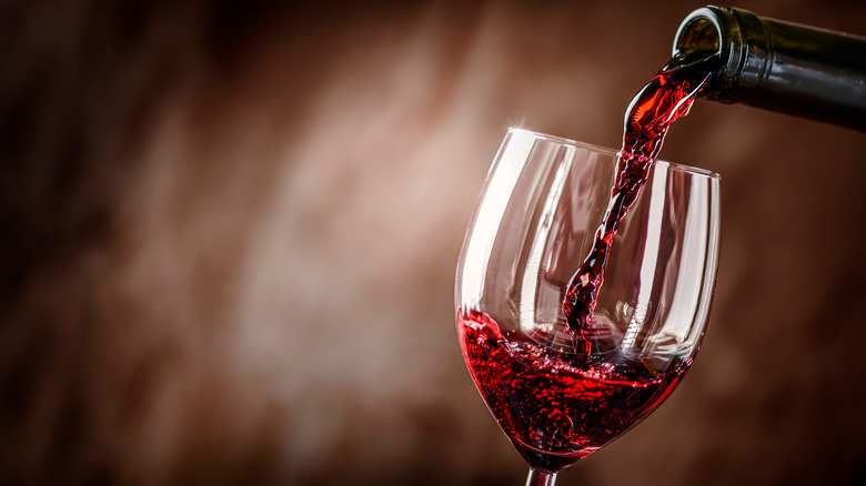 Red wine being poured into a wine glass