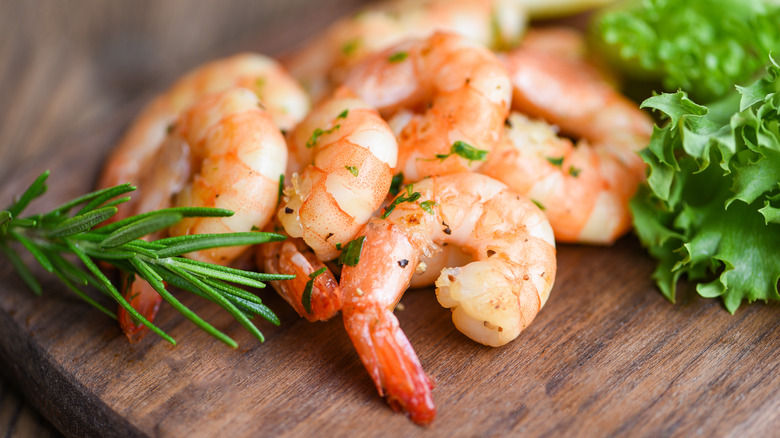 Cooked shrimp on a board