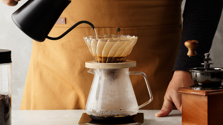 pouring coffee through filter