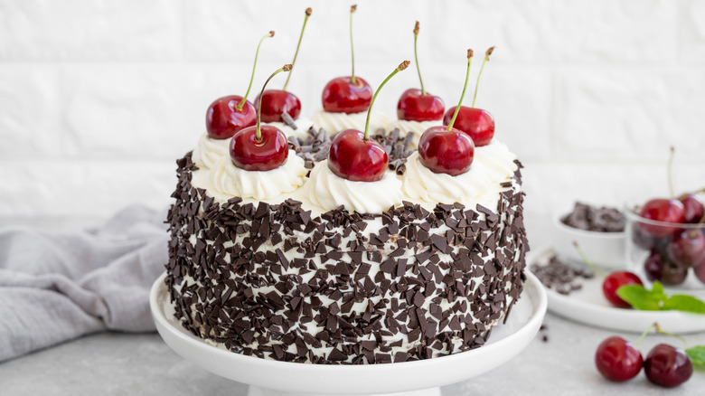 white cake with chocolate chips and cherries