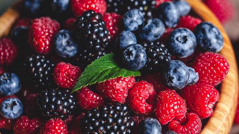 wooden bowl with mixed berries