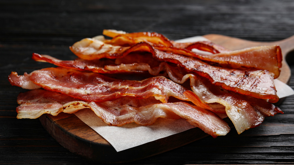 bacon on wooden cutting board