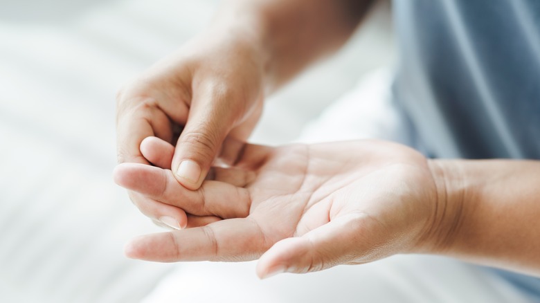 person with gout in fingers