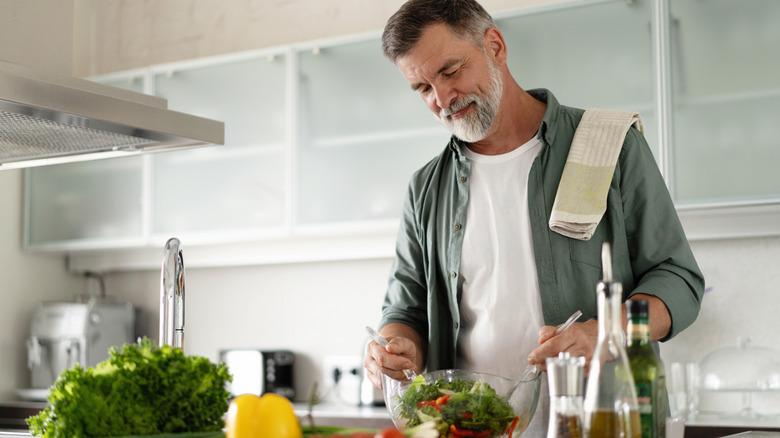 Man preparing a hearty salad