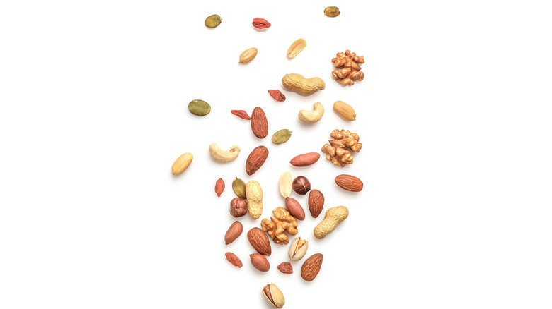 assorted nuts on white background