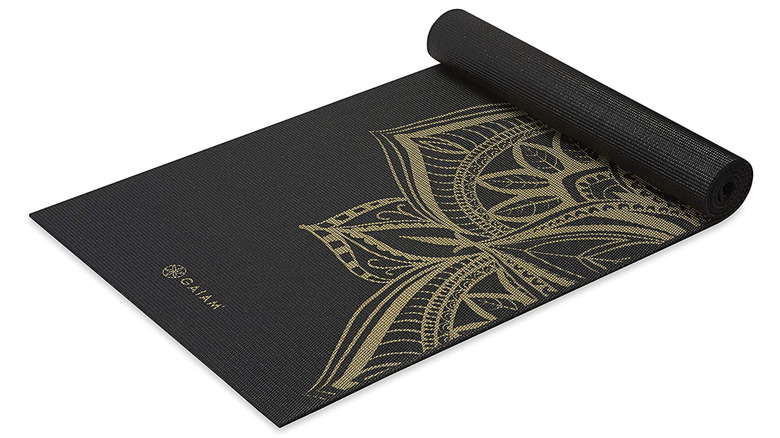 black yoga mat with gold design