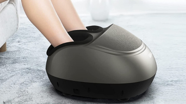 legs in foot massager machine