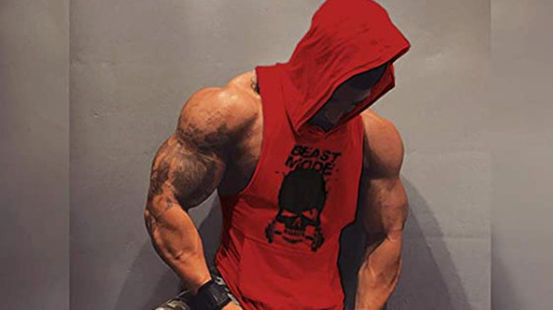 man in red hooded vest