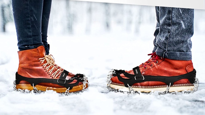 crampons on two pairs of feet 