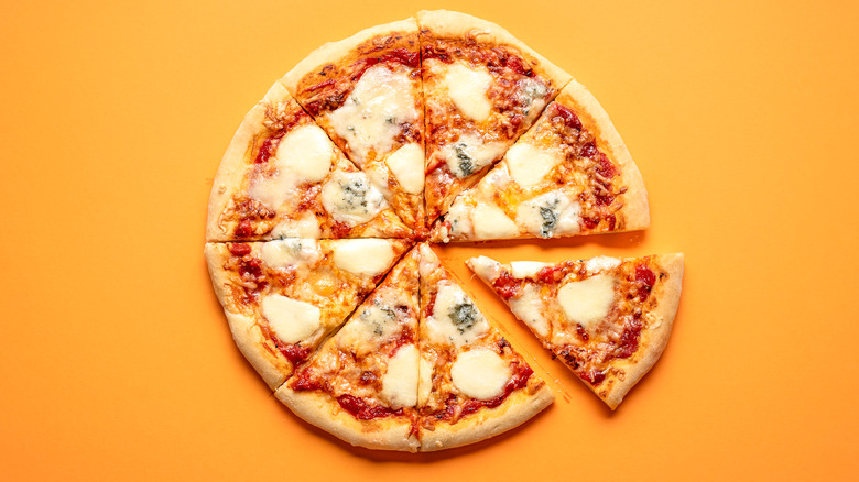 cheese pizza on orange background