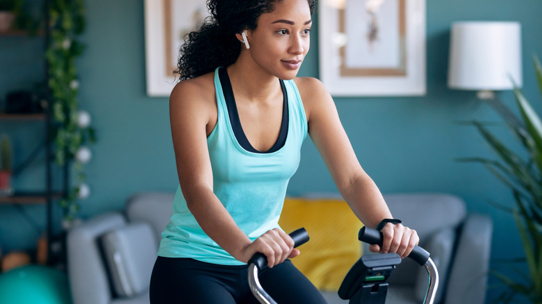 woman doing an at-home cycling class