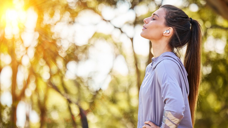 woman taking deep breath