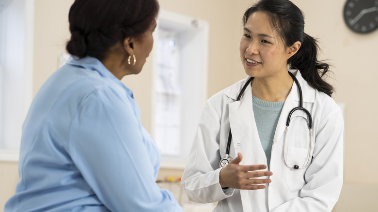 woman talking to doctor