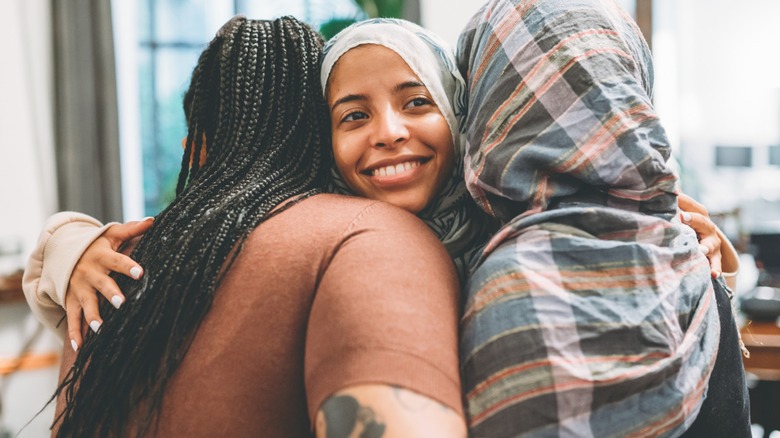 muslim women hugging