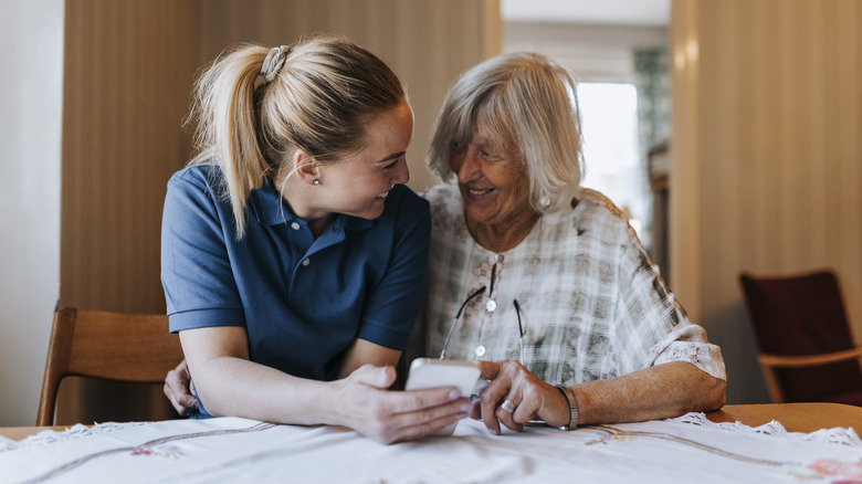 Woman caring for elderly relative