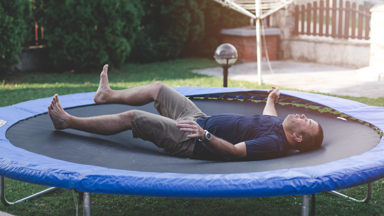 man fallen and injured on trampoline