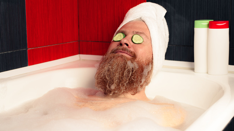 man taking a bubble bath