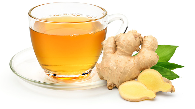 cup of tea with ginger and mint leaves 