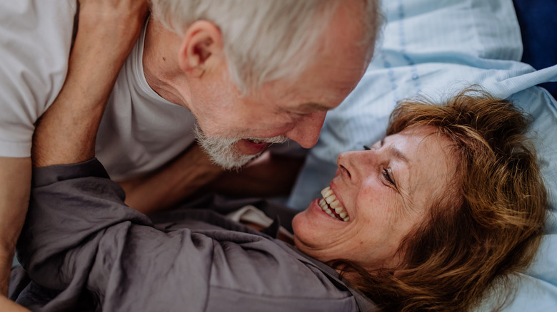 Older couple together in bed