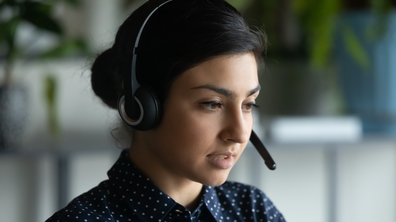 Woman actively listening on headset