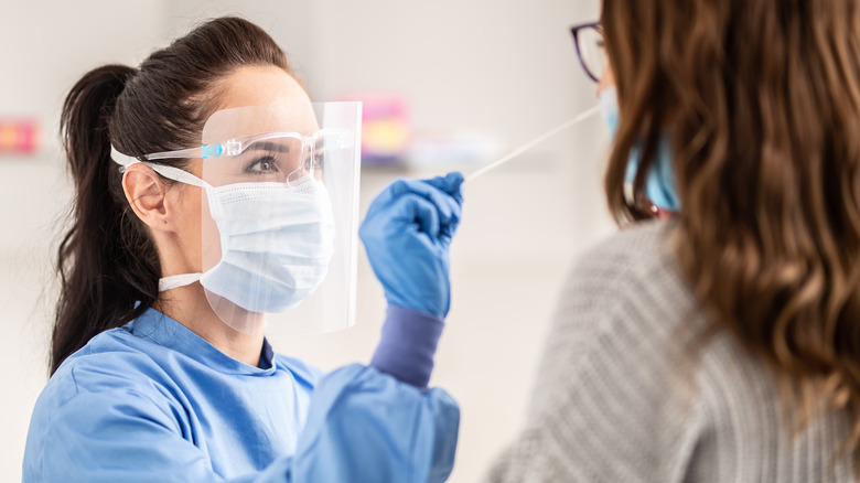 person taking PCR test for covid