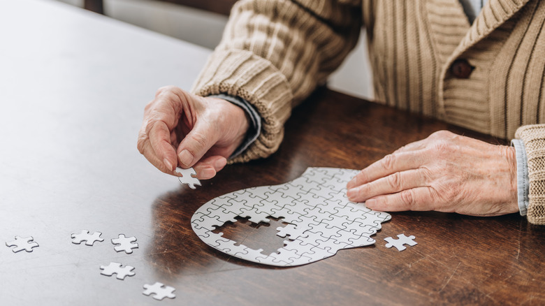 man doing a puzzle