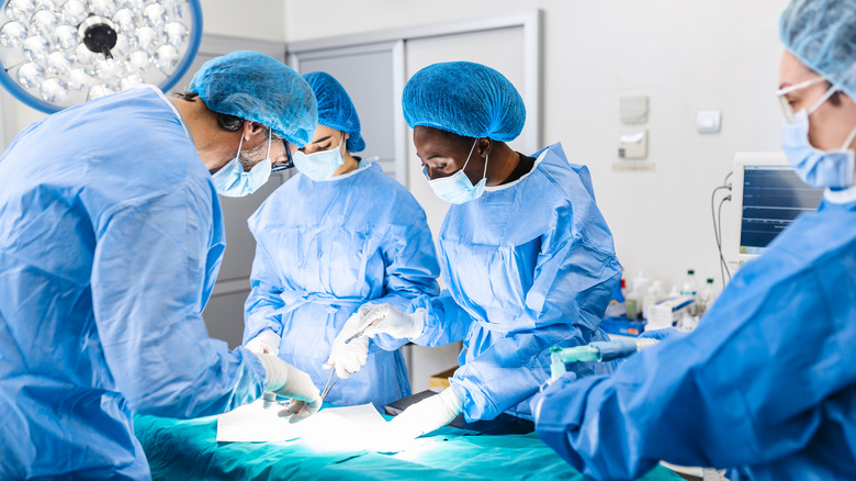 Surgical team conducting surgery