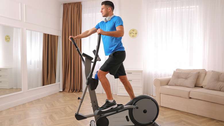 Man using elliptical