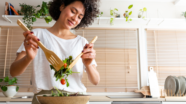 woman tossing a salad