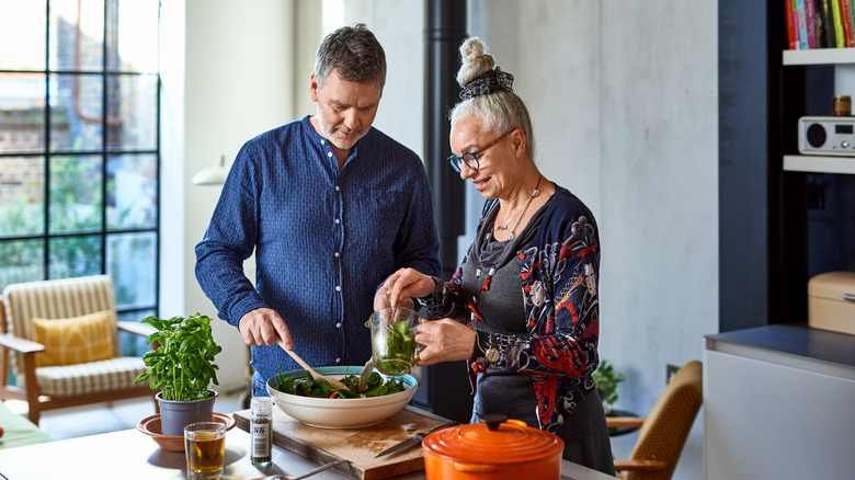 olde adults cooking in the kitchen