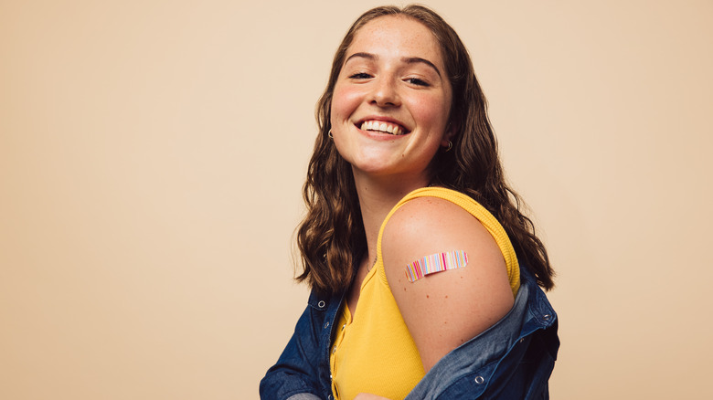 Woman with bandage on arm 