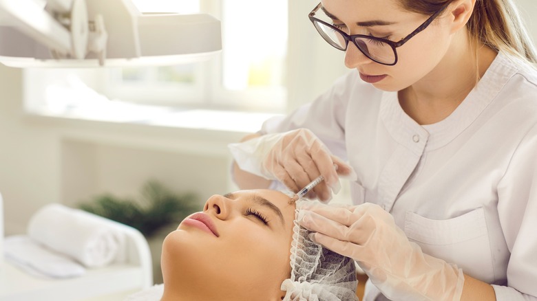Women getting cosmetic procedure 