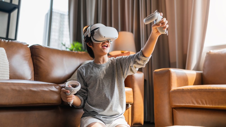 boy playing a VR video game