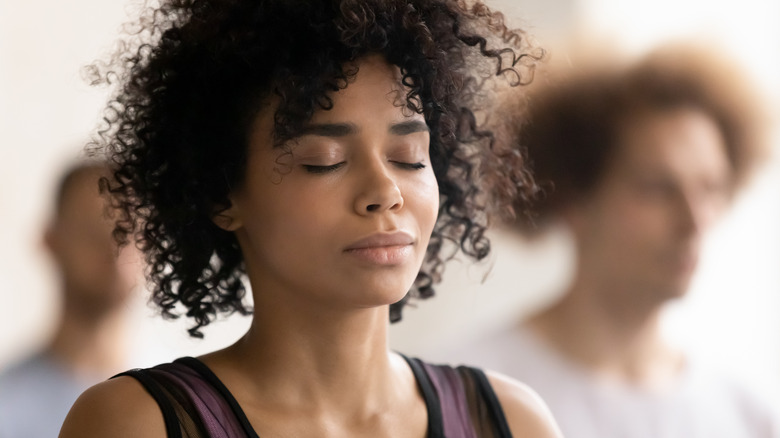 Woman engaging in deep breathing