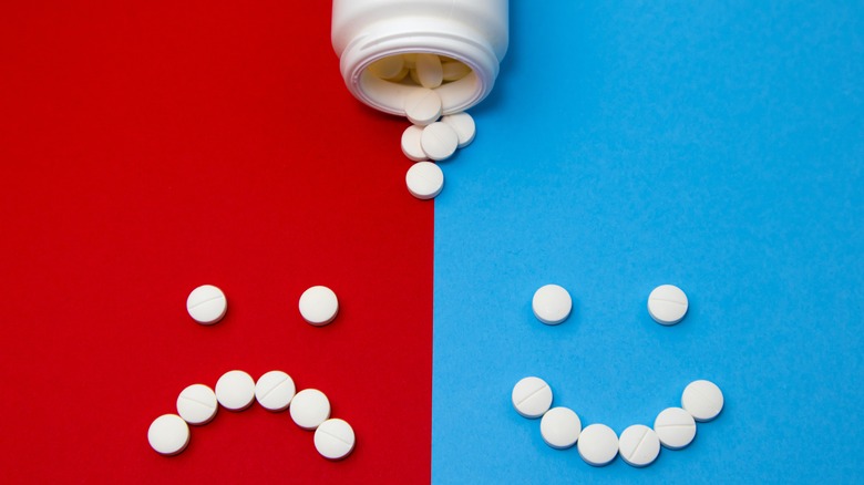 pills making a happy and sad face