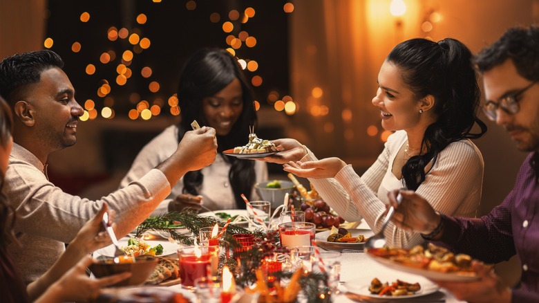 people sharing christmas dinner 