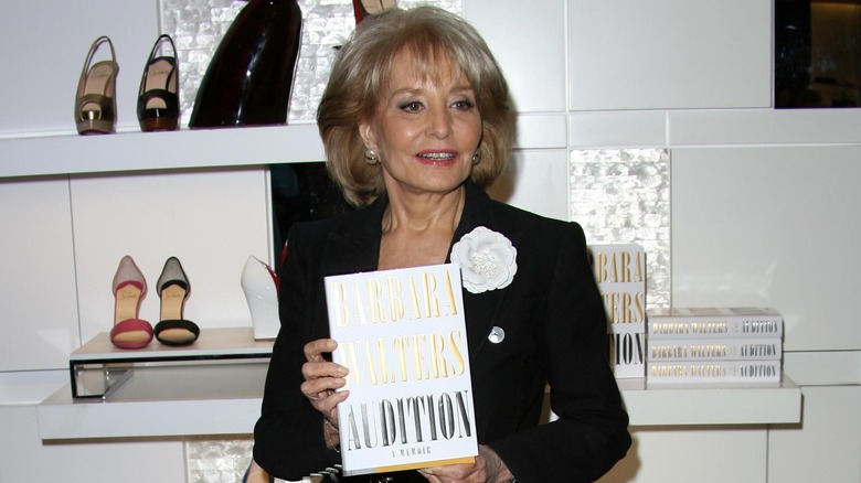 Barbara Walters holding her book Audition