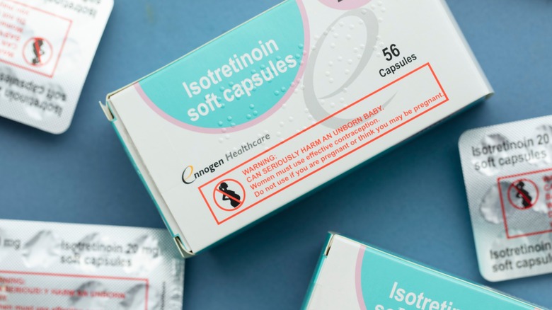 Isotretinoin medication on blue background