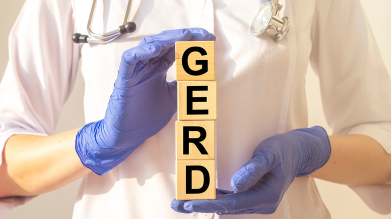 doctor holding GERD blocks