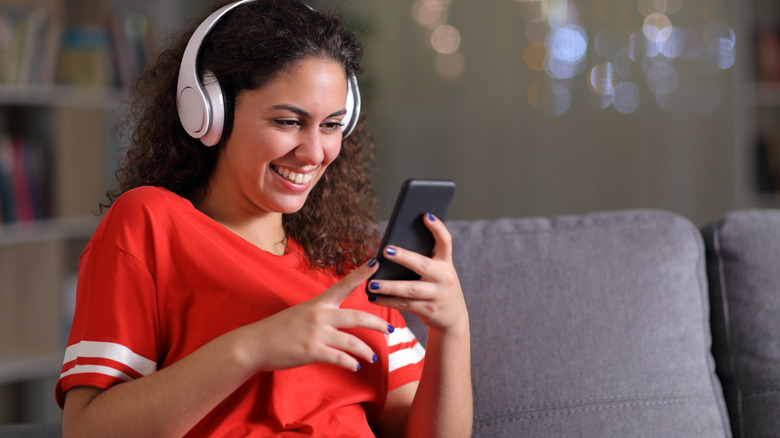 woman listening to music with headphones