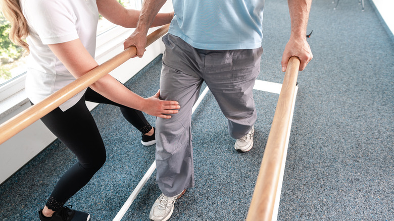 man in physical therapy walking