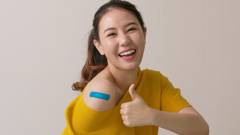 Woman with Band-Aid on her arm