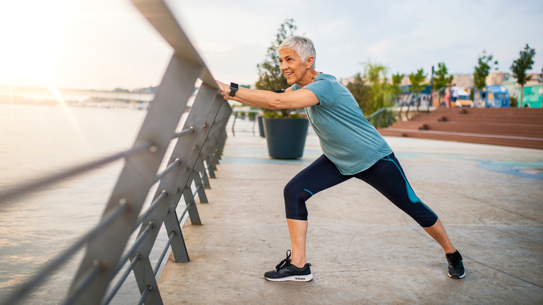 woman stretching after run