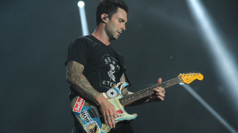 adam levine plays guitar