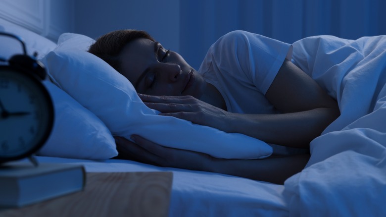 Woman asleep in bed