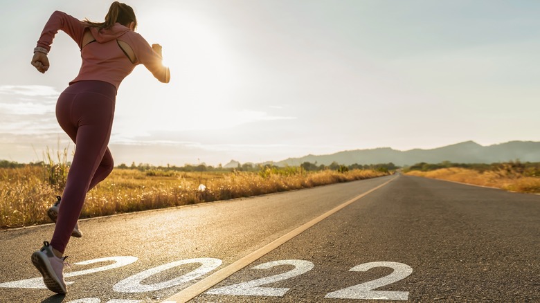 Person running down road