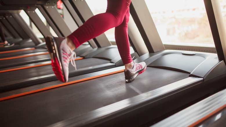 woman's legs running on treadmill