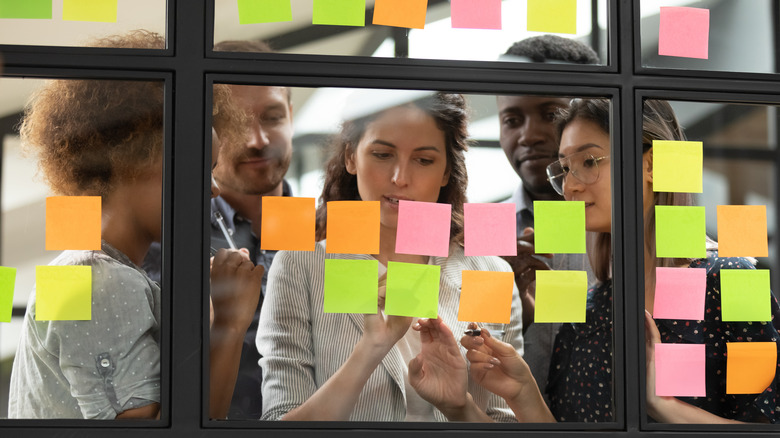 Co-workers planning and organizing in a meeting